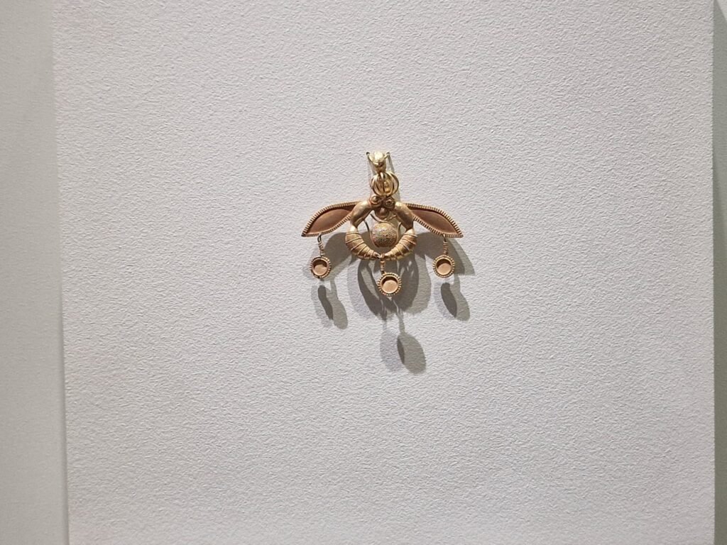 Close-up detail of the Malia Pendant's gold filigree and granulation work, Heraklion Archaeological Museum