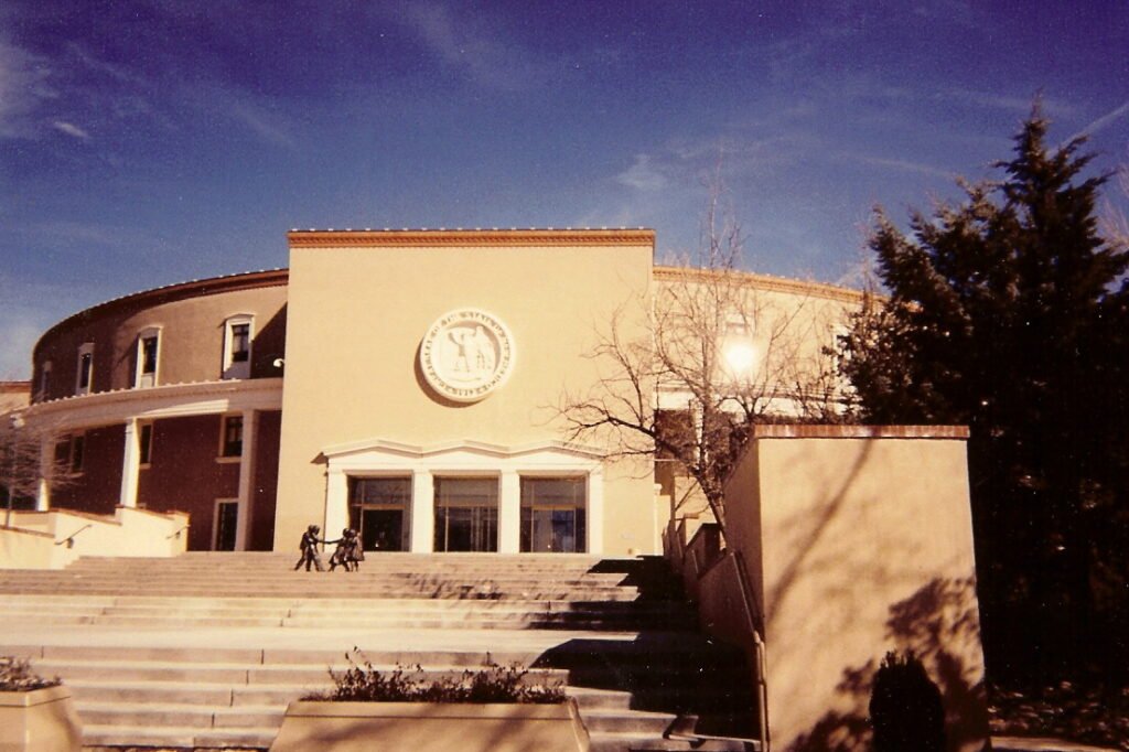 Exterior of the New Mexico State Capitol, the circular Roundhouse, representing state beekeeping law authority in Santa Fe