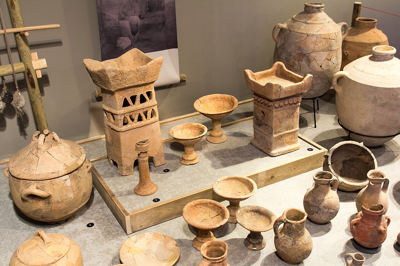 Iron Age pottery vessels, cult stands, and jars excavated from Tel Rehov, displayed at the Eretz Israel Museum