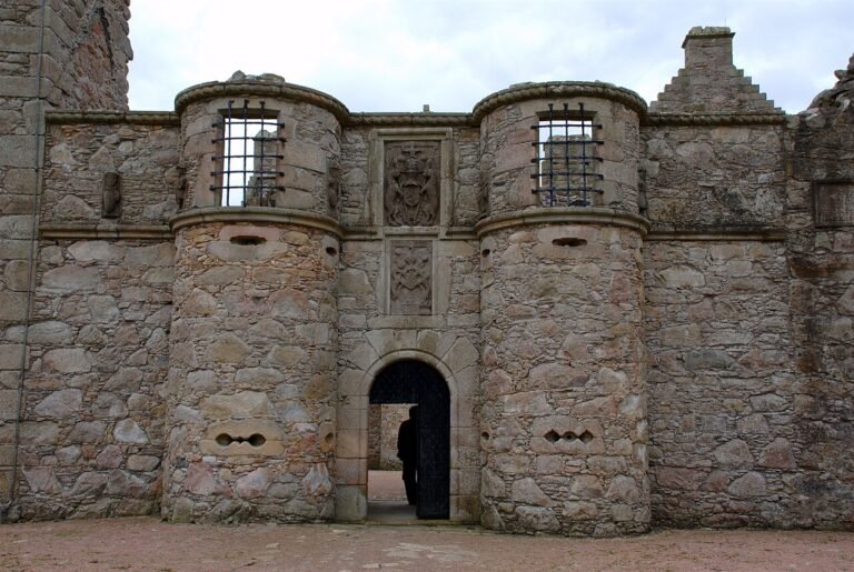 Photograph of the fortified stone entrance of Tolquhon Castle in Aberdeenshire, Scotland, showing its distinctive defensive firing slits