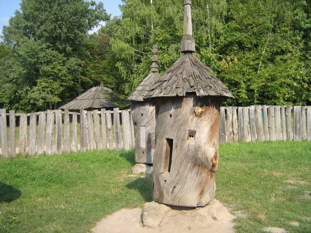 Traditional Ukrainian vulik log beehive representing pre-frame-hive beekeeping methods