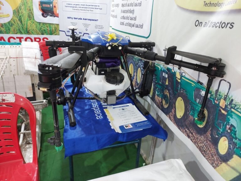 Agricultural drone on display at a farming technology exhibition, similar to drones used for orchard pollination and bloom mapping