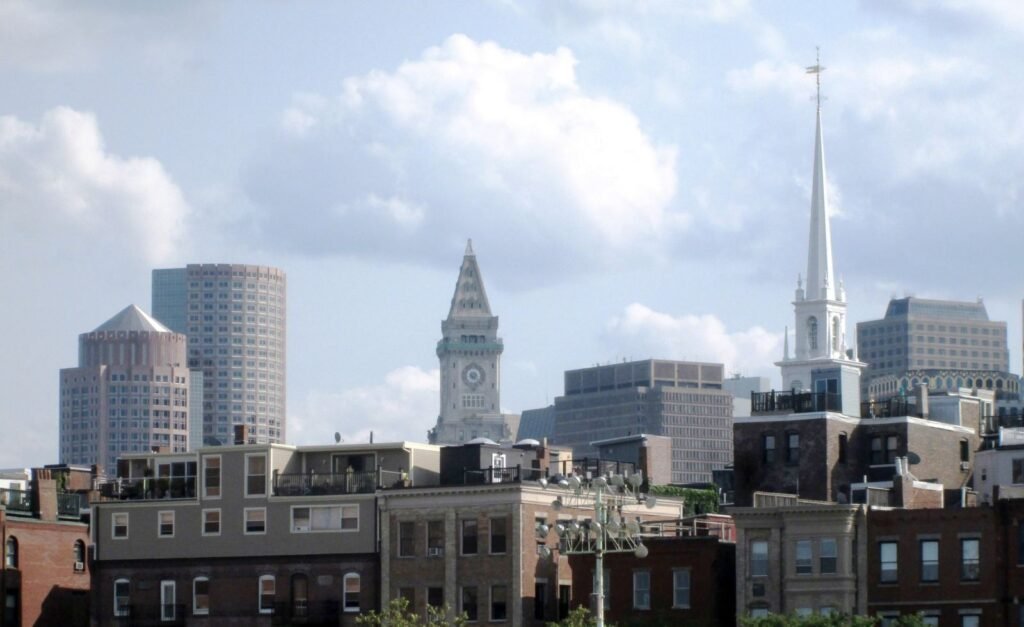 The Boston skyline viewed from the harbor, the city whose 2024 ordinance overhauled its beekeeping rules