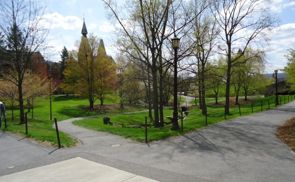 Cornell University campus pathways and quad with Gothic tower visible in the background