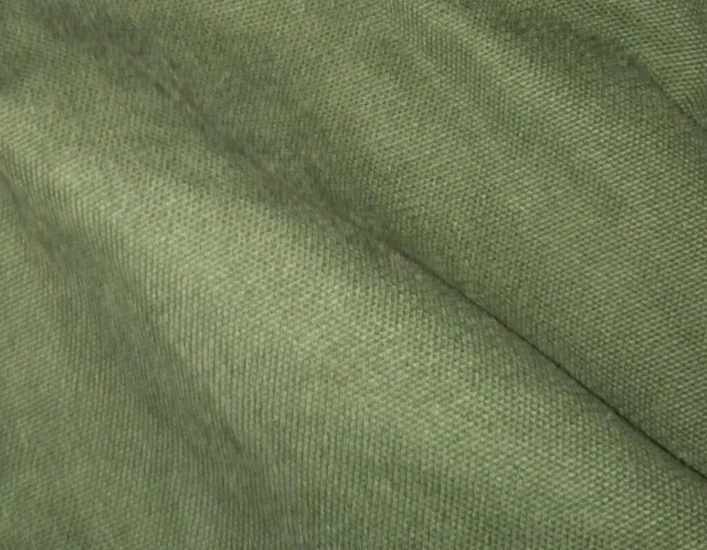 A close-up of cotton duck canvas, the tightly-woven natural fabric traditionally waxed with beeswax for waterproofing
