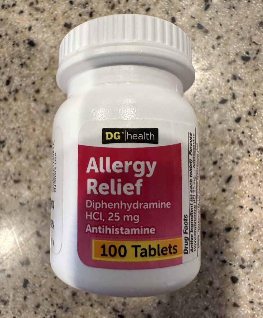 Bottle of diphenhydramine allergy relief tablets, the antihistamine sometimes used for pets under veterinary guidance