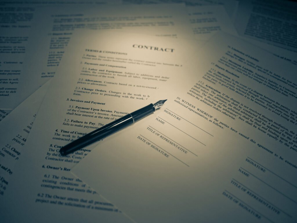 A person signing legal paperwork, the kind of brief written plan that helps an executor locate and care for a beekeeper's hives