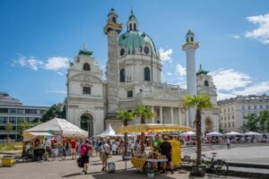 Honey festival market stalls at Karlsplatz in Vienna, Austria, with vendors selling honey and related products