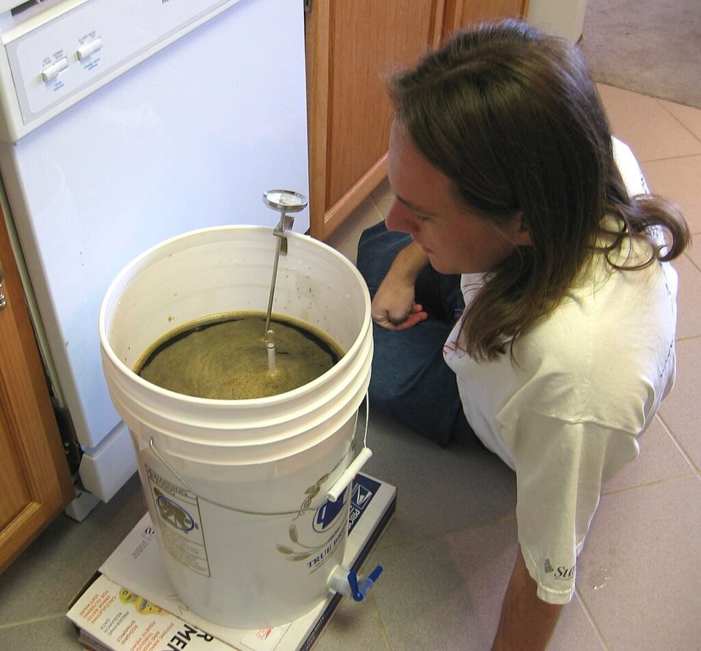 Hydrometer being used to check the specific gravity of a fermenting homebrew batch