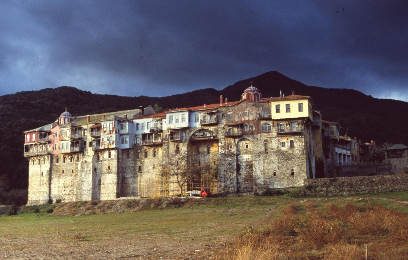 Iviron Monastery on Mount Athos, a large stone Orthodox monastic complex at dusk