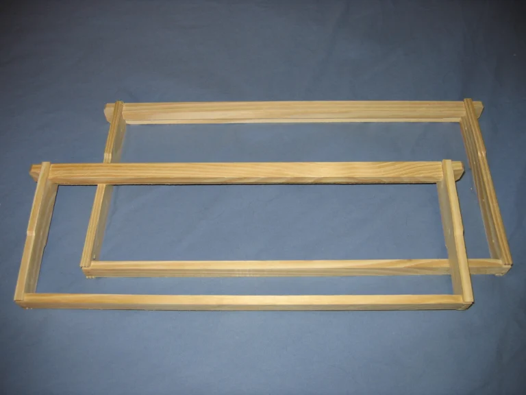 Wooden Langstroth beehive frame with a wedge top bar, the component beekeepers compare for brand compatibility