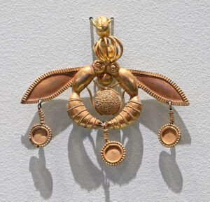 Ancient gold Malia Pendant showing two bees holding a honeycomb, Heraklion Museum