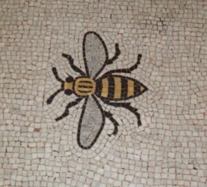 Mosaic of Manchester's worker bee symbol set into the Town Hall floor