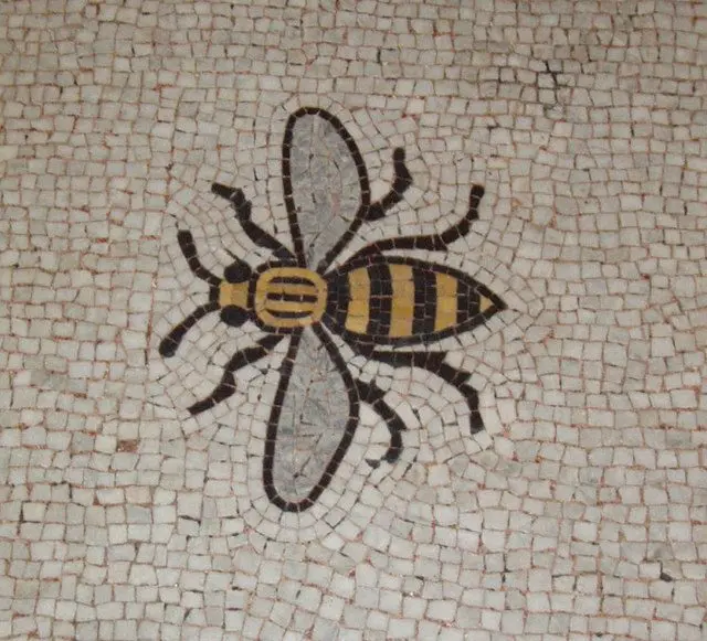 Mosaic of Manchester's worker bee symbol set into the Town Hall floor