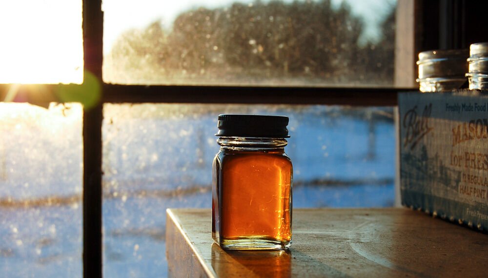 A bottle of Vermont maple syrup, a plant-based sweetener some vegans use in place of honey