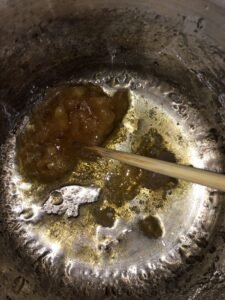 Raw beeswax being melted down for a craft project