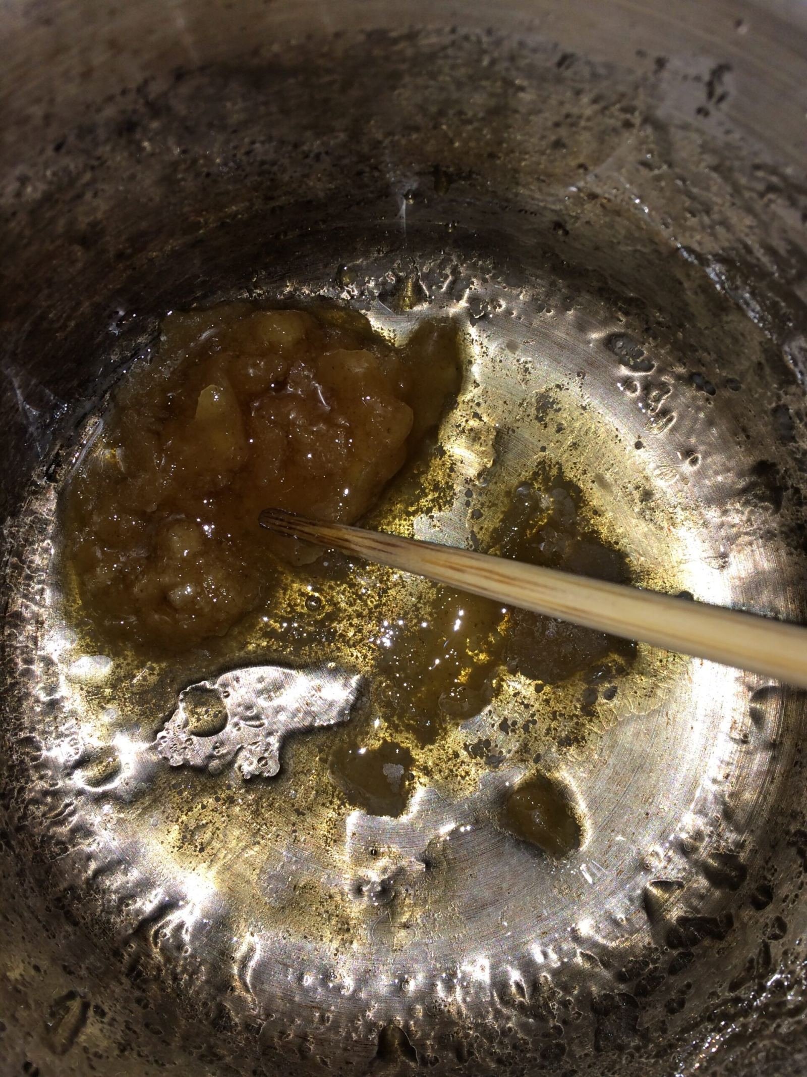 Raw beeswax being melted down for a craft project
