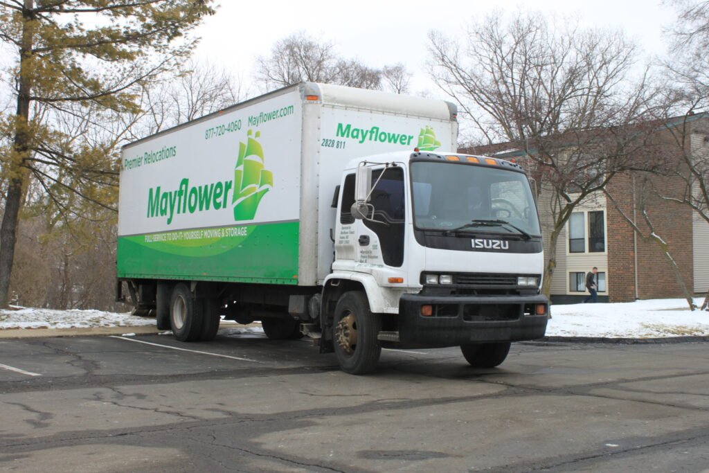A moving truck used for relocation, illustrating an interstate move that can also involve relocating a purchased bee colony