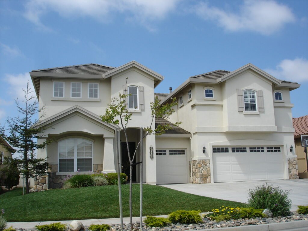Suburban house with a fenced backyard, the kind of space where hive placement matters most with young kids present
