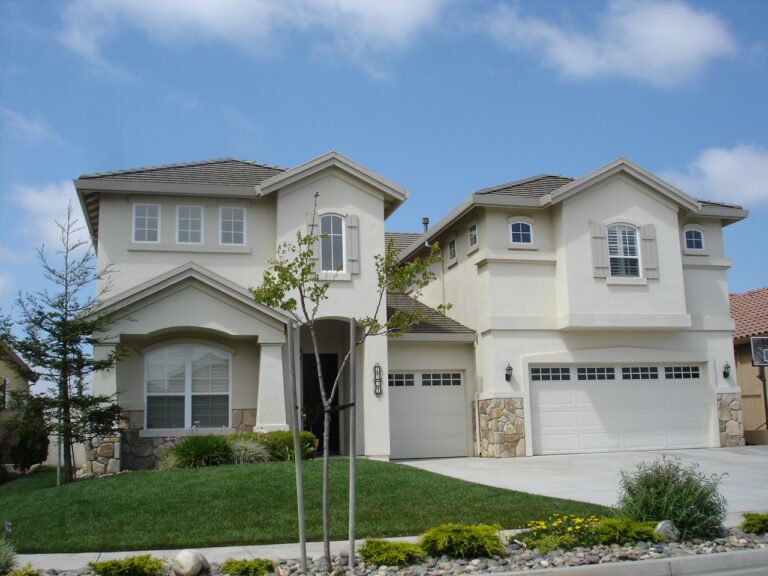 Single-family suburban tract house with a fenced backyard typical of an HOA-governed neighborhood