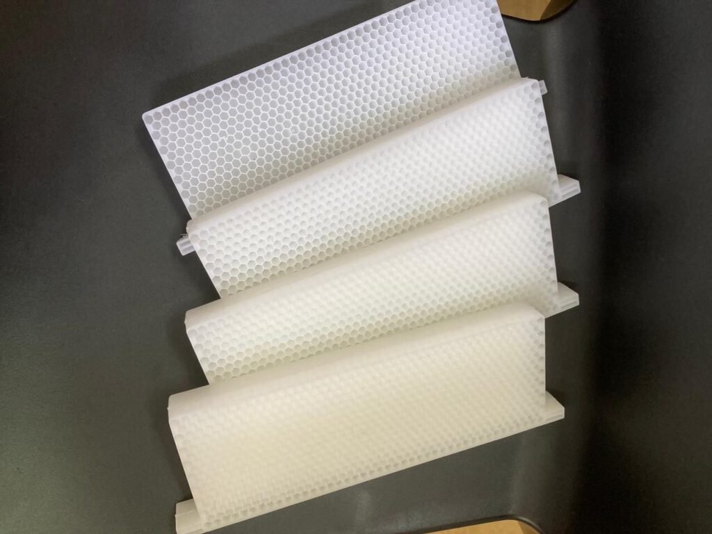 New plastic honeycomb foundation sheets formed for beehive frames before installation