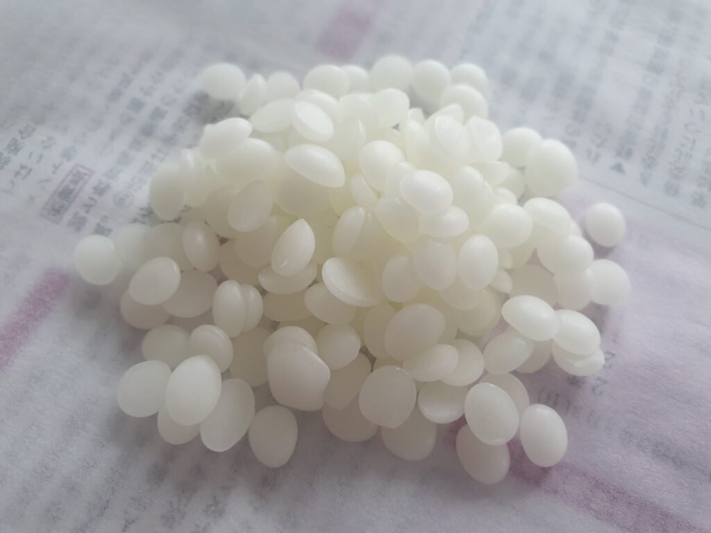 Raw beeswax pellets, the base ingredient in most quality mustache wax and beard balm