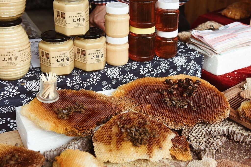 Jars of raw honey for sale at a market, illustrative of the honey supply chain affected by transshipping fraud