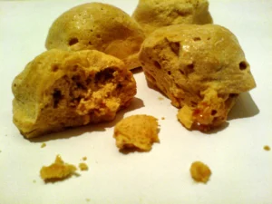 Close-up of cinder toffee showing the bubbly honeycomb candy texture