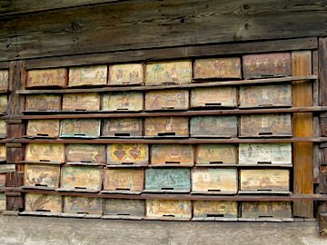 Close-up of a hand-painted Slovenian beehive front panel from Anton Jansa's own hives