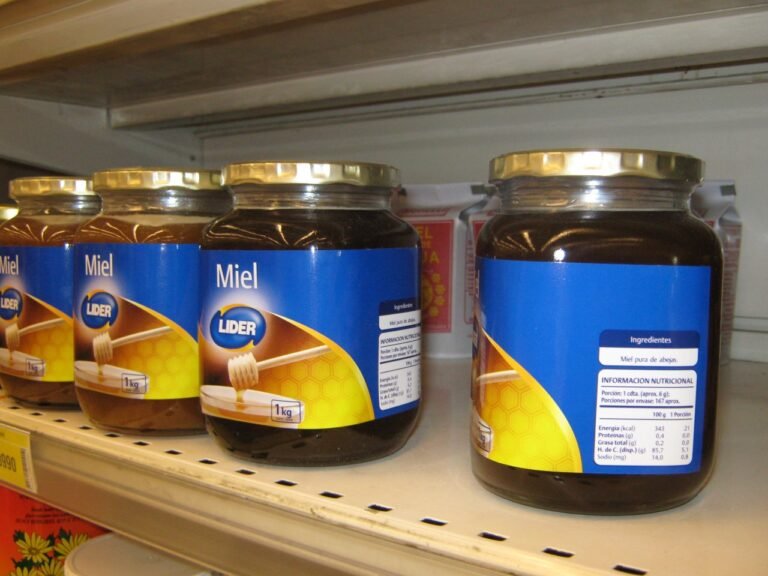 Jar of raw honey illustrating glass as a sustainable, low-waste packaging material