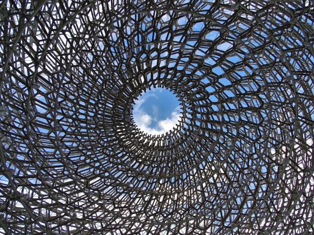 Looking straight up inside The Hive at Kew Gardens through the aluminum lattice and LED lights
