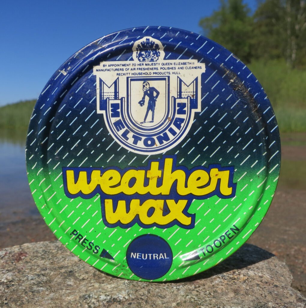 A vintage tin of Meltonian Weather Wax -- an example of the beeswax-based 'dubbin' style leather waterproofing sold for over a century
