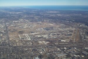 Aerial view of O'Hare International Airport showing large tracts of open airfield land near runways