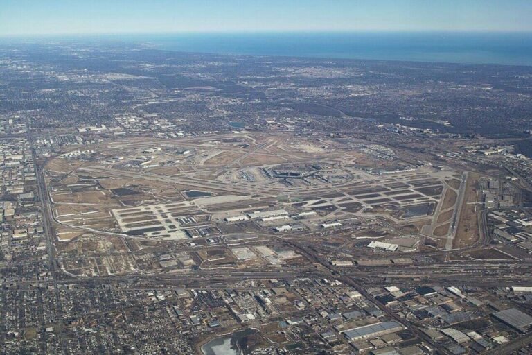Aerial view of O'Hare International Airport showing large tracts of open airfield land near runways