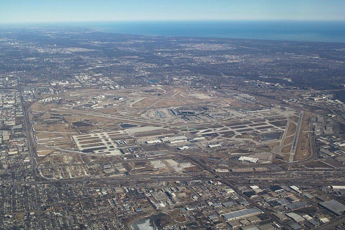 Aerial view of O'Hare International Airport showing large tracts of open airfield land near runways